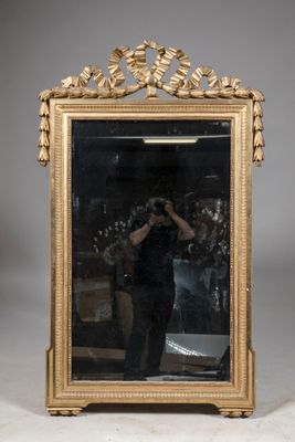 a man taking a picture of himself in a mirror