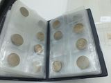 a book with a bunch of coins inside of it