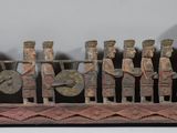 many figurines that are sitting on a wooden stand