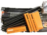 a box of train tracks and a box of boxes on the ground