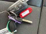 a bunch of keys that are sitting on the back seat of a car