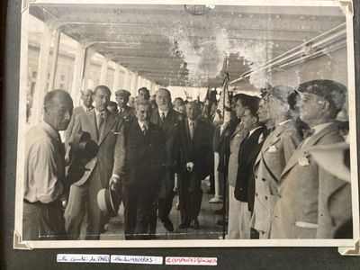 a black and white photo of a group of men in suits and ties