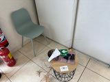 a chair and a table in the corner of a room