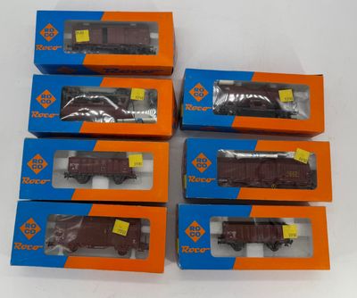six boxed boxes of toy trains sitting on top of a white surface
