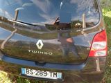 a small car that is parked in the grass