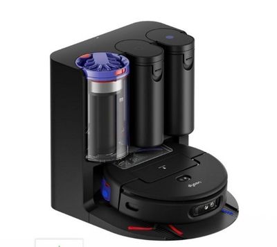 a black coffee maker with two cups on top of it