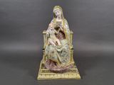 an image of a figurine of a woman holding a child