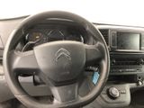 the interior of a car with a steering wheel and dashboard controls