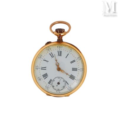 a gold pocket watch with roman numerals on the face