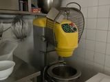 a machine that is sitting in a kitchen next to a sink