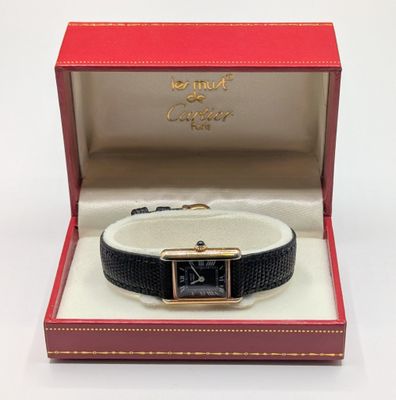 an image of a watch in a box on a white surface