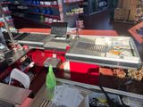 a counter in a store with a lot of food on it