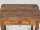an old wooden table with a drawer underneath it on a white surface