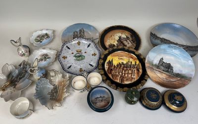 many plates and bowls that are sitting on a table