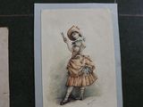 many pictures of a woman in a dress on a table