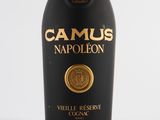 an old bottle of wine with a gold seal on it