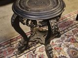 a small table that is on a rug in a room