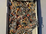 a box full of assorted metal items on a table