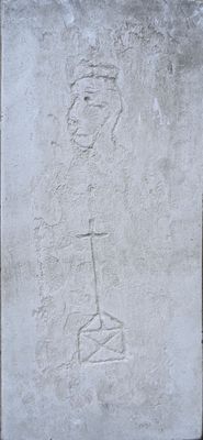 a stone plaque with a drawing of a man on it