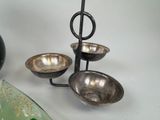 three bowls and a spoon sitting on a table
