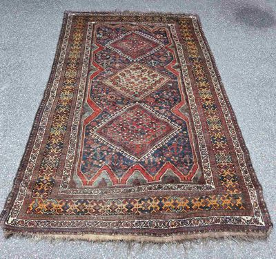 an old persian rug is laying on the floor in a room