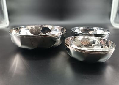 three bowls sitting on a table next to each other