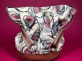 an image of a purse on a pink background