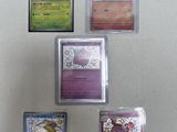four different types of pokemon cards are displayed on a white surface