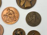 a lot of coins that are on a white surface
