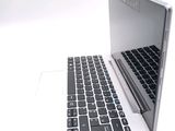 a laptop computer sitting on top of a white table