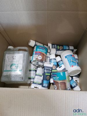 a box full of toilet paper and other cleaning products