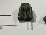 three toy tanks that are on display on a table