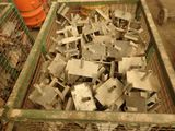 many pieces of metal sitting in a cage