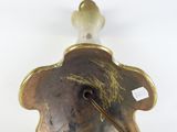 brass plated lamp with a glass shade and a metal handle