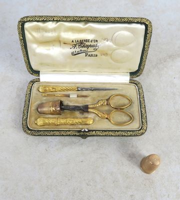 a box with a pair of scissors and a pair of scissors in it