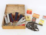 a wooden box with a variety of tools in it