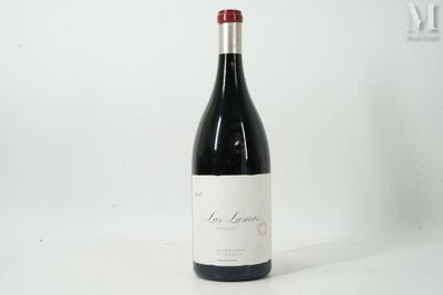 a bottle of wine that is sitting on a table