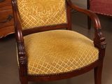 two chairs that are sitting next to each other in a room