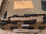 a cardboard box with a knife and fork in it