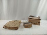 three boxes that are sitting on a bed