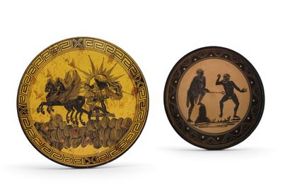 two decorative plates with figures on them sitting next to each other