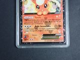 a pokemon card in a plastic container on a table