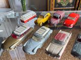 a lot of toy cars that are sitting on a table