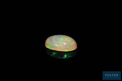 a white oplite in the dark with a green light