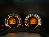 two speedometers on the dashboard of a car
