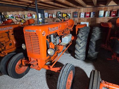 a tractor that is parked in a garage