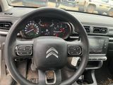 the interior of a car with a steering wheel, dashboard, and dashboard gauges