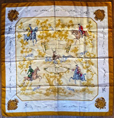 an image of a yellow and white scarf with a picture of people riding horses