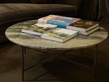 a coffee table with books on top of it in a living room