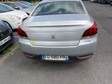 a silver car parked on the side of the road